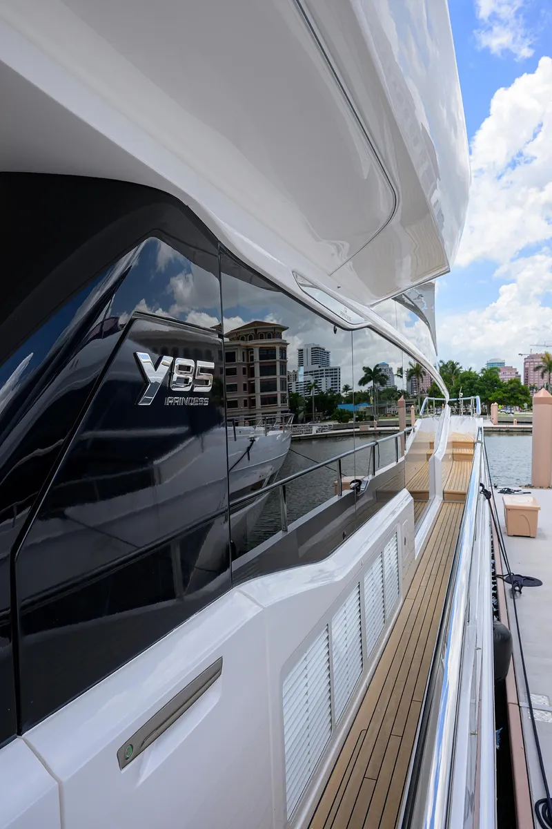 Slide: The Image of 2025 Princess Y85 Motor Yacht docked, showcasing sleek design and luxury features. - 28