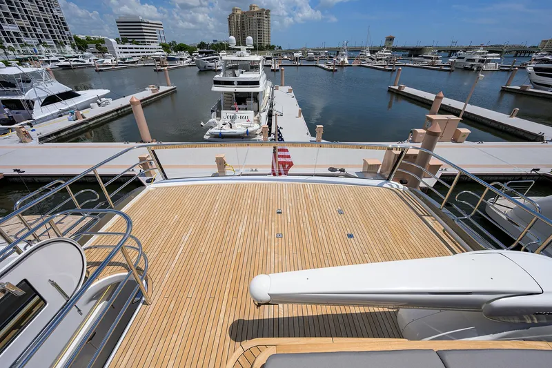Slide: The Image of Princess Y85 Motor Yacht 2025 docked at a marina with spacious deck view. - 42