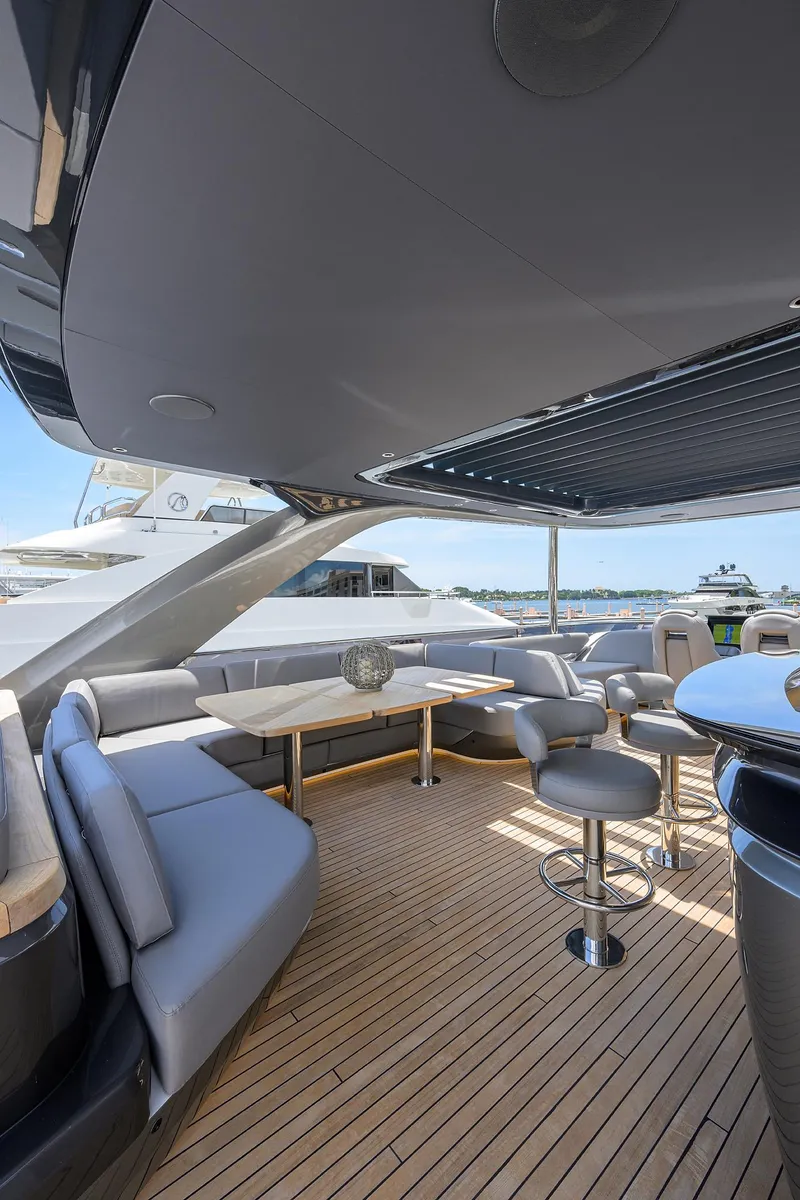 Slide: The Image of Luxurious 2025 Princess Y85 Motor Yacht deck with modern seating and ocean view. - 48