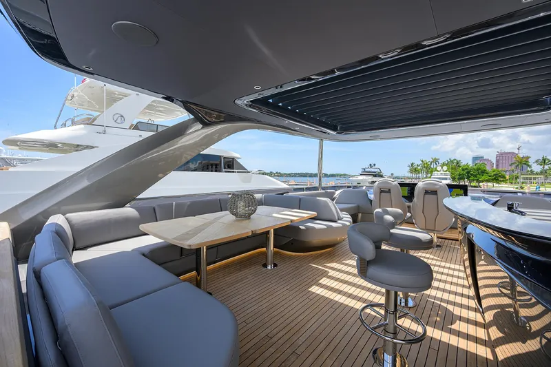 Slide: The Image of Luxurious 2025 Princess Y85 Motor Yacht with elegant outdoor seating and modern design. - 49