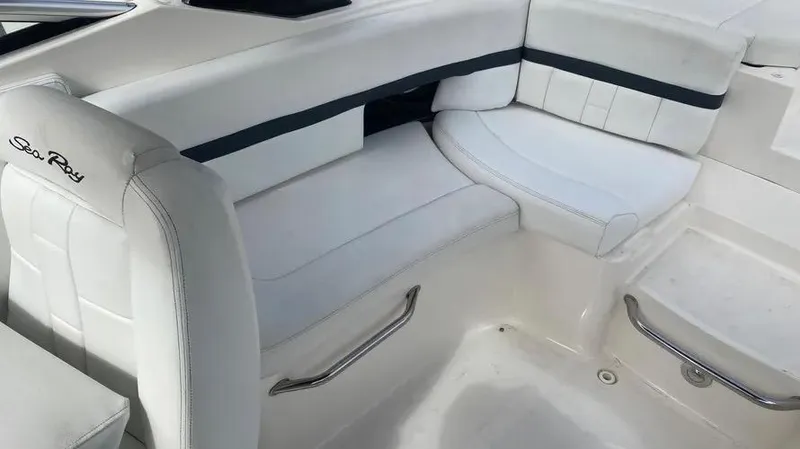 Slide: The Image of 2015 Sea Ray 250 SLX boat interior with white leather seating. - 17