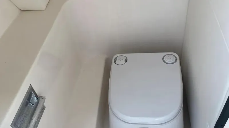 Slide: The Image of 2015 Sea Ray 250 SLX boat toilet compartment interior. - 19