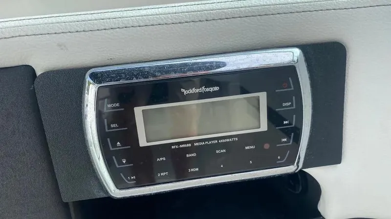 Slide: The Image of Rockford Fosgate audio system in 2015 Sea Ray 250 SLX boat dashboard. - 20
