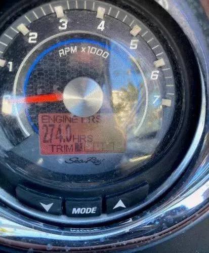 Slide: The Image of Close-up of 2015 Sea Ray 250 SLX tachometer displaying engine hours and RPM. - 23