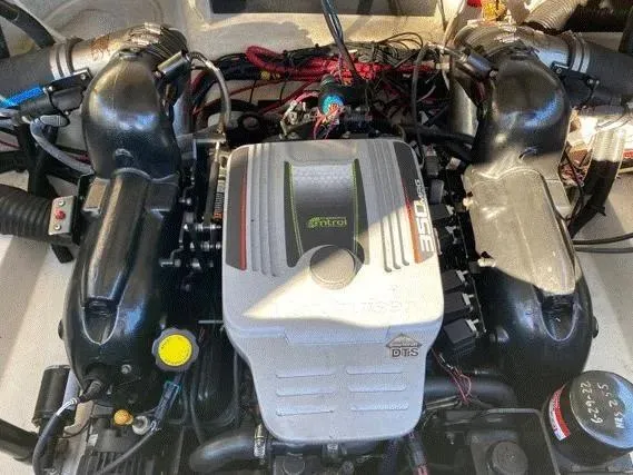 Slide: The Image of 2015 Sea Ray 250 SLX engine, detailed view of components and wiring. - 28