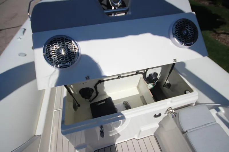 Slide: The Image of 2025 Zodiac Medline 6.8 NEO boat storage compartment open, showing spacious interior. - 13