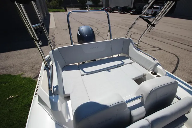Slide: The Image of 2025 Zodiac Medline 6.8 NEO boat interior with seating and engine view. - 15