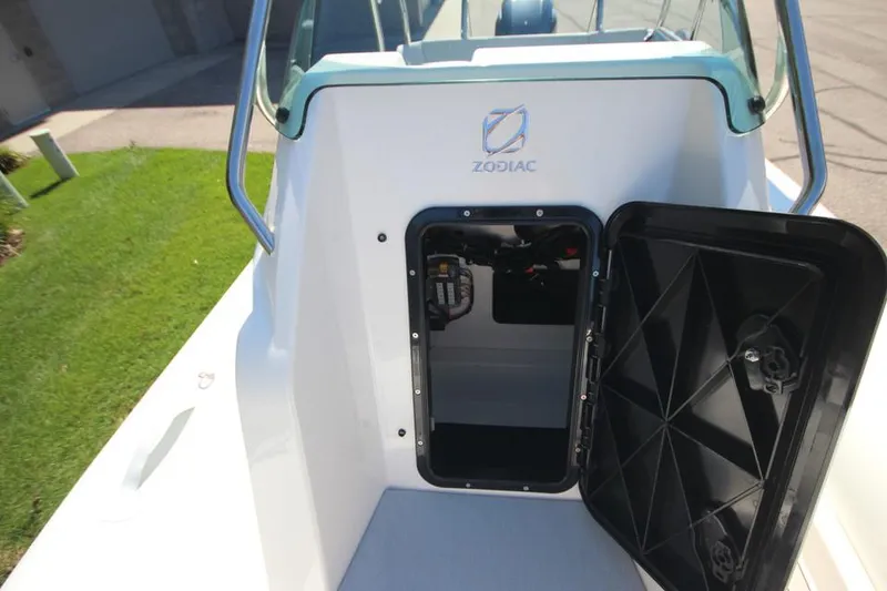 Slide: The Image of 2025 Zodiac Medline 6.8 NEO boat interior with seating and table, showcasing modern design. - 23