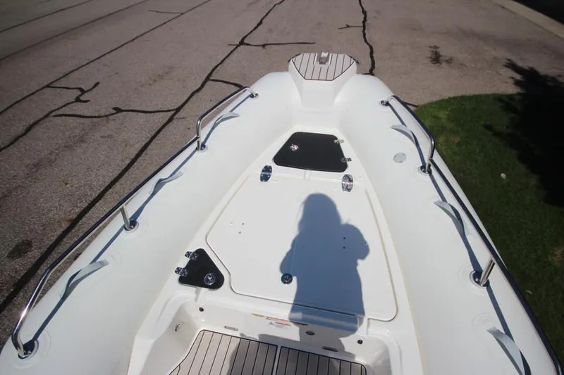 Slide: The Image of 2025 Zodiac Medline 6.8 NEO boat battery compartment with visible wiring and components. - 26