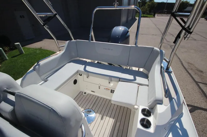 Slide: The Image of 2025 Zodiac Medline 6.8 NEO boat interior with steering wheel and seating. - 10