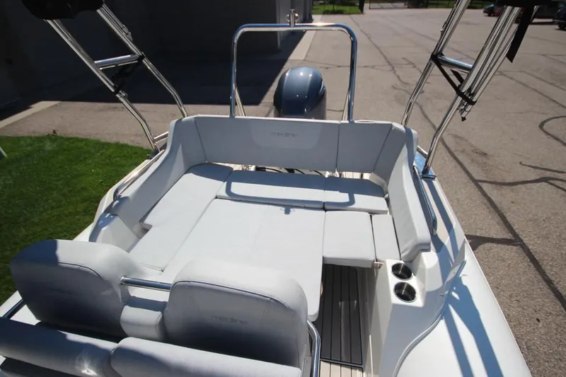 Slide: The Image of 2025 Zodiac Medline 6.8 NEO boat interior with open storage compartment. - 14
