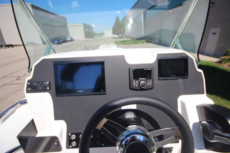 Slide: The Image of 2025 Zodiac Medline 6.8 NEO boat interior with seating and control panel. - 20