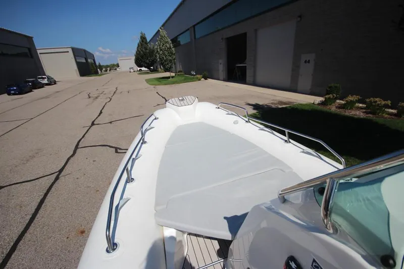 Slide: The Image of 2025 Zodiac Medline 6.8 NEO boat storage compartment with open lid, showcasing interior space. - 25