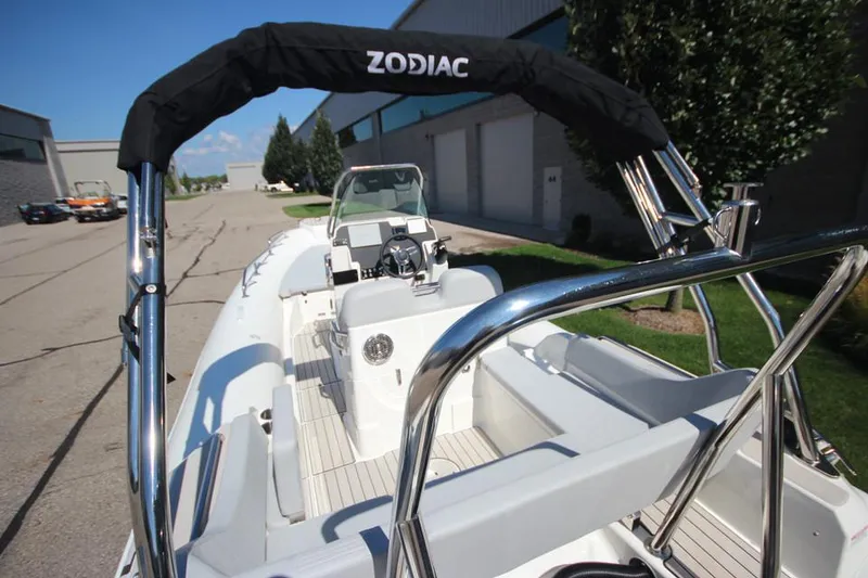 Slide: The Image of 2025 Zodiac Medline 6.8 NEO boat in stock, parked outside warehouse. - 7