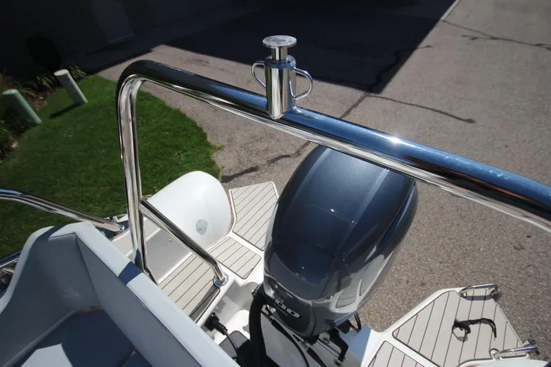 Slide: The Image of 2025 Zodiac Medline 6.8 NEO boat with 200hp engine, docked outdoors. - 8
