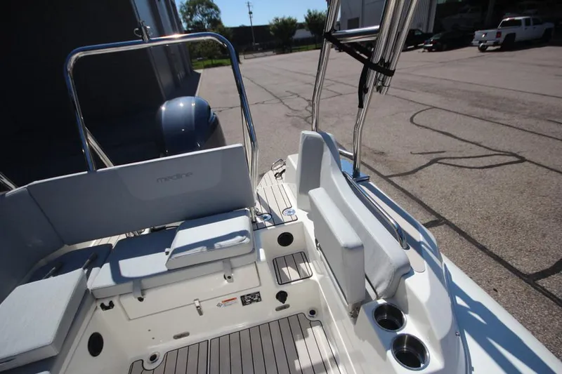 Slide: The Image of 2025 Zodiac Medline 6.8 NEO boat interior with seating and steering wheel. - 9