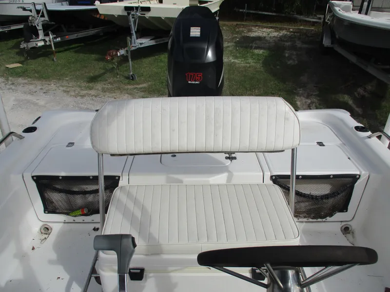 Slide: The Image of 2005 Fishmaster 22 boat interior with white seating and 175 horsepower engine. - 5