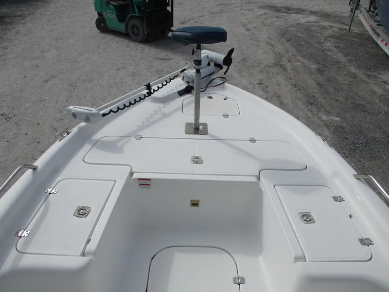 Slide: The Image of 2005 Fishmaster 22 boat deck with storage compartments and trolling motor. - 7