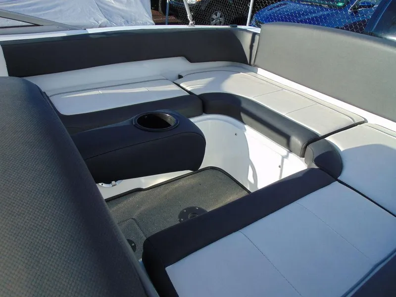 Slide: The Image of 2015 Caravelle 19EBo boat interior with cushioned seating and cup holder. - 13