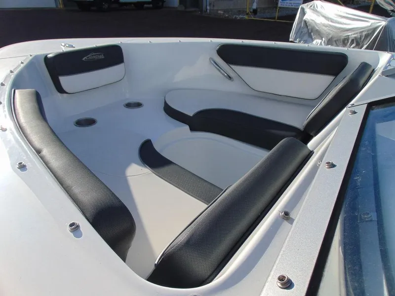 Slide: The Image of 2015 Caravelle 19EBo boat interior with black and white seating. - 14