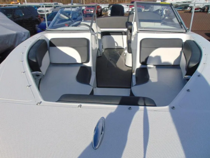 Slide: The Image of 2015 Caravelle 19EBo boat interior with white and gray seating. - 15