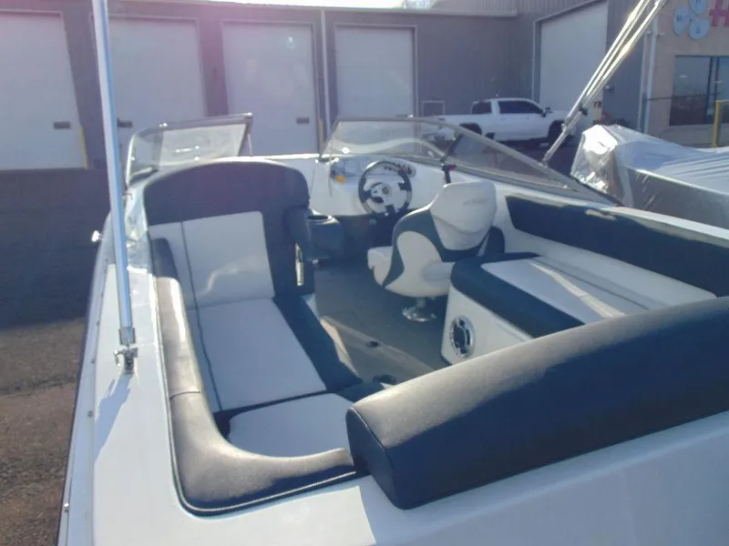 Slide: The Image of 2015 Caravelle 19EBo boat interior with seating and steering wheel. - 5