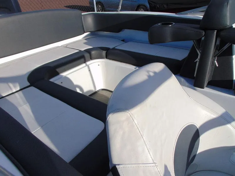 Slide: The Image of 2015 Caravelle 19EBo boat interior with white and gray seating. - 8