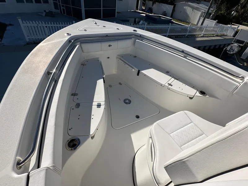 Slide: The Image of 2023 Sea Pro 239 Deep V CC boat interior with spacious seating and storage compartments. - 13