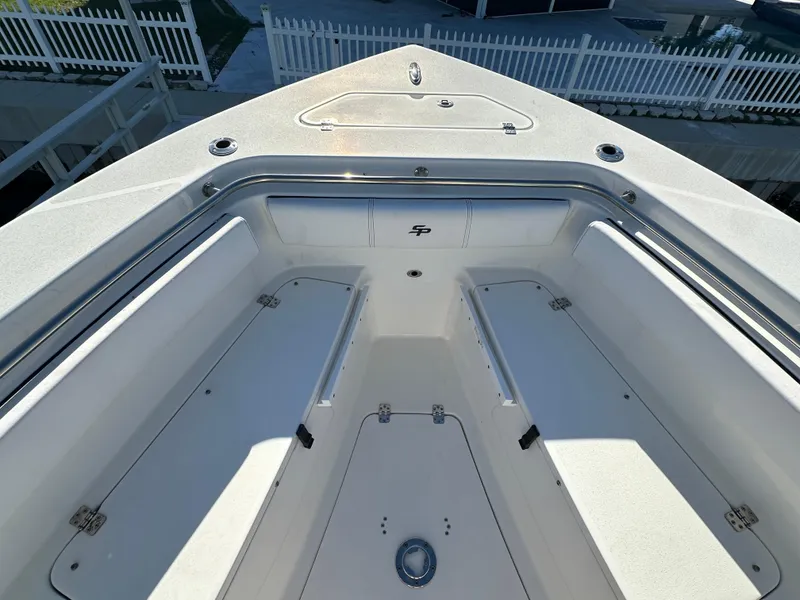 Slide: The Image of 2023 Sea Pro 239 Deep V CC boat interior with spacious seating and storage. - 14