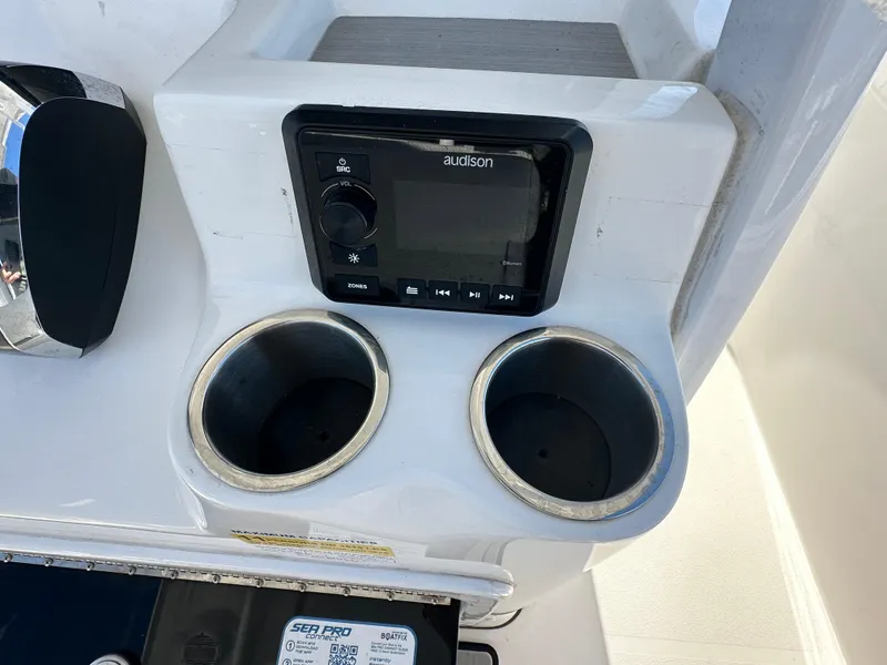 Slide: The Image of 2023 Sea Pro 239 Deep V CC console with audio system and cup holders. - 20