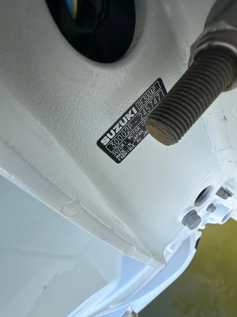 Slide: The Image of Close-up of Suzuki engine part on 2023 Sea Pro 239 Deep V CC boat. - 23