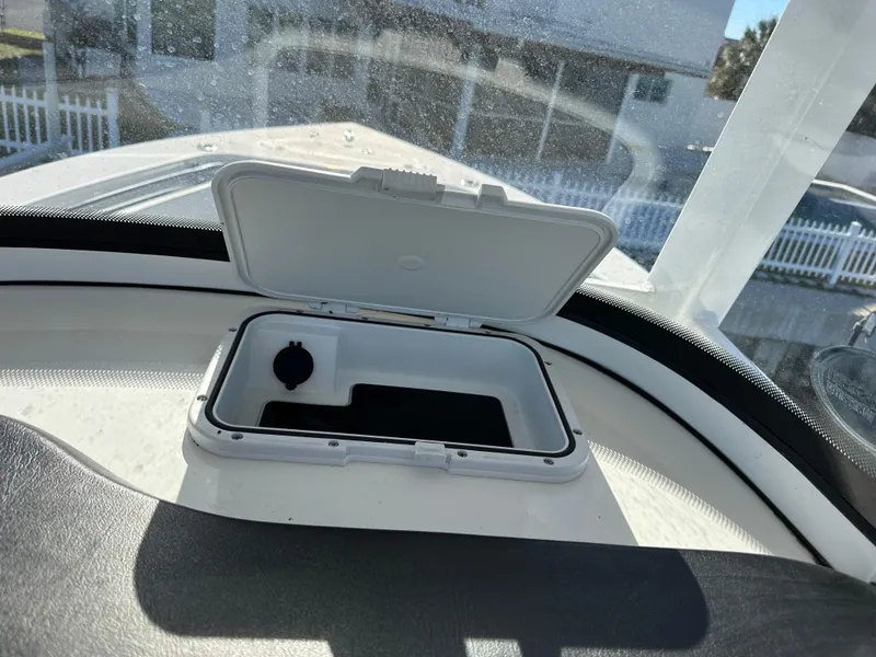 Slide: The Image of Open storage compartment on 2023 Sea Pro 239 Deep V CC boat. - 26