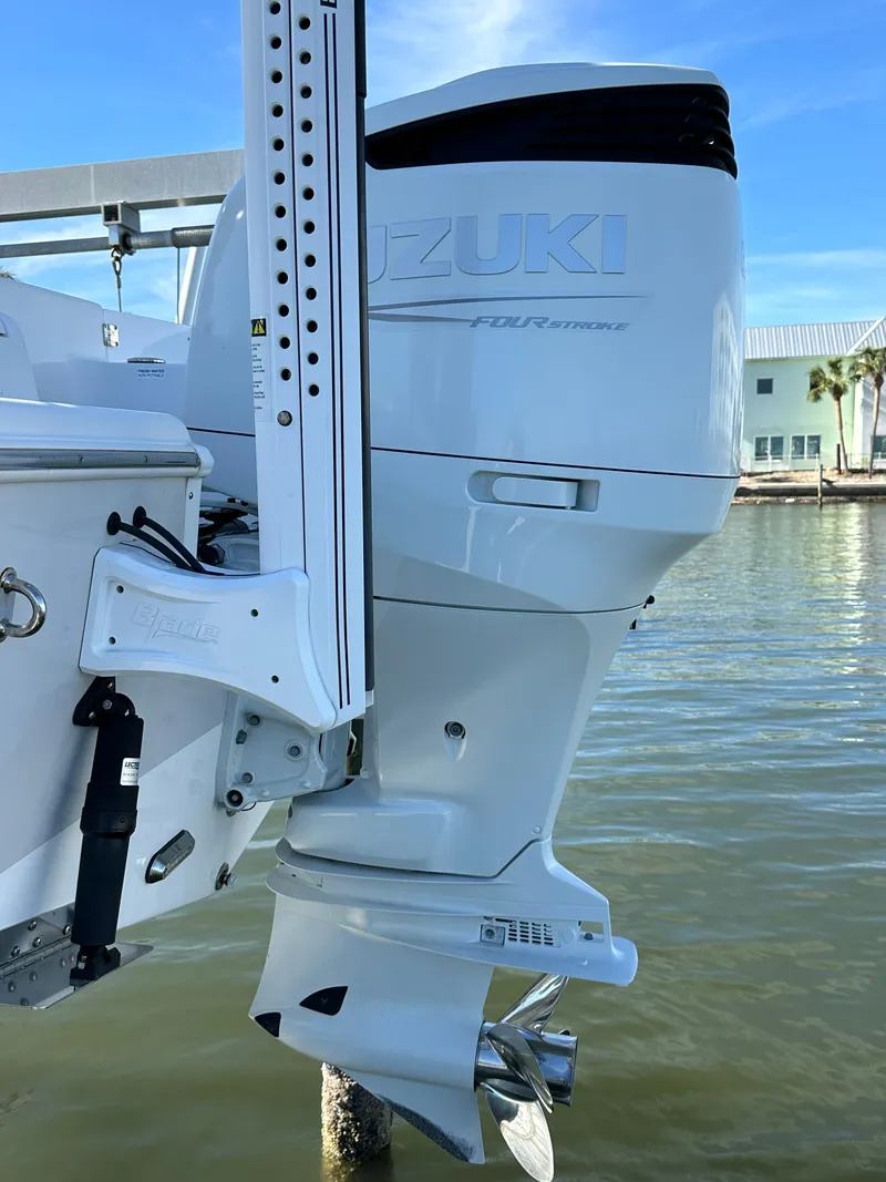 Slide: The Image of 2023 Sea Pro 239 Deep V CC with Suzuki outboard motor on water. - 28