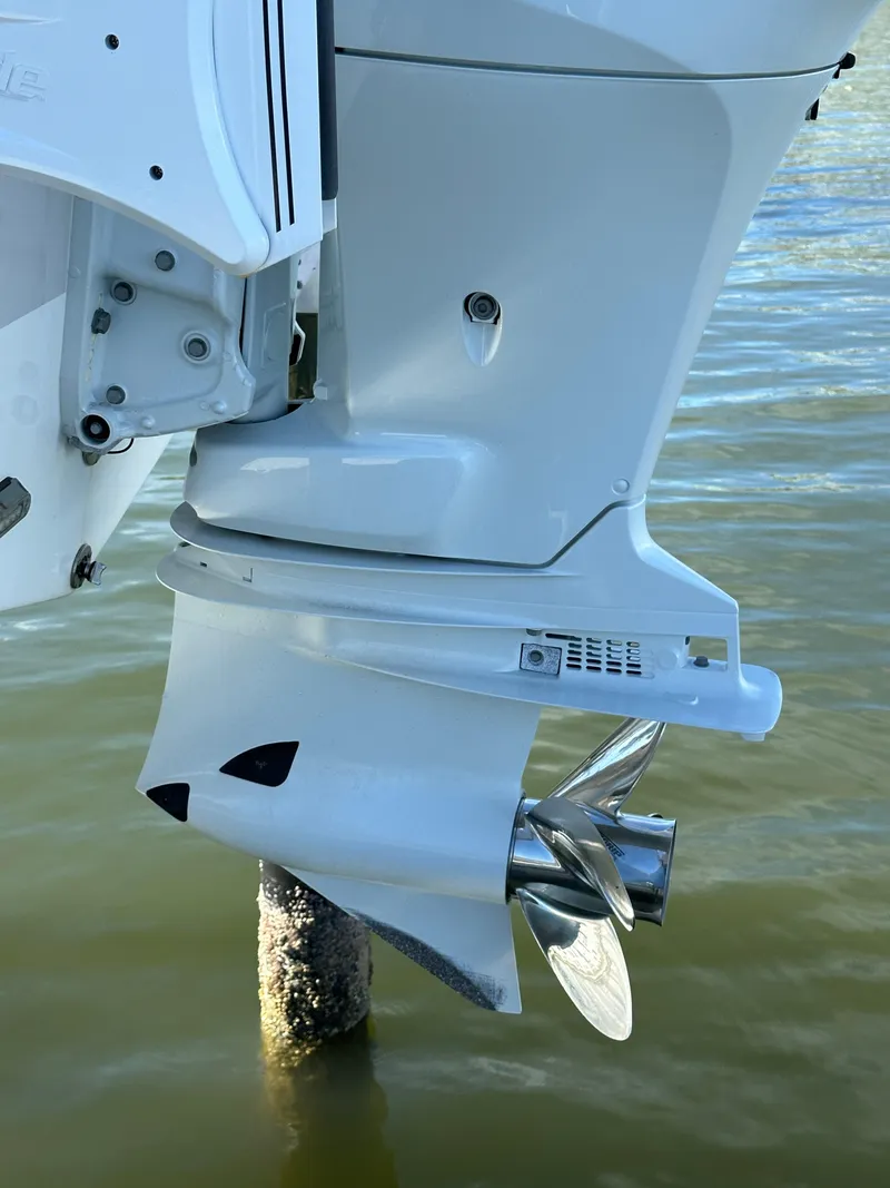 Slide: The Image of 2023 Sea Pro 239 Deep V CC boat motor and propeller in water. - 29