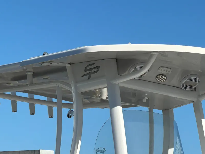 Slide: The Image of 2023 Sea Pro 239 Deep V CC boat top against clear blue sky. - 3