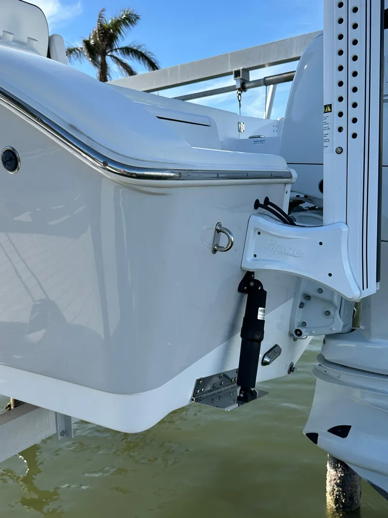 Slide: The Image of 2023 Sea Pro 239 Deep V CC boat stern with motor mount in marina. - 30