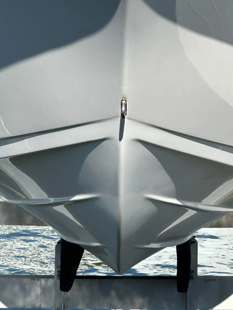 Slide: The Image of 2023 Sea Pro 239 Deep V CC boat hull on trailer, close-up view. - 34