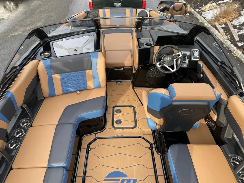 Slide: The Image of 2025 Malibu Wakesetter 22 MXZ boat rear view with Power Wedge and surf gate. - 10