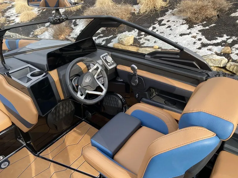 Slide: The Image of 2025 Malibu Wakesetter 22 MXZ boat with luxurious seating and sleek design. - 12