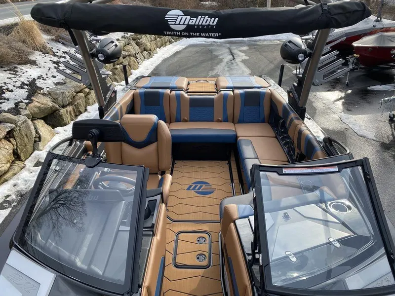 Slide: The Image of 2025 Malibu Wakesetter 22 MXZ boat interior with modern steering and control panel. - 15