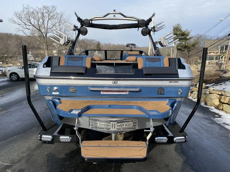 Slide: The Image of 2025 Malibu Wakesetter 22 MXZ engine compartment with open hatch, showcasing interior details. - 20