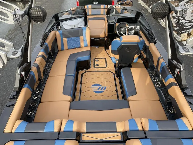 Slide: The Image of 2025 Malibu Wakesetter 22 MXZ boat parked on driveway, rear view. - 9