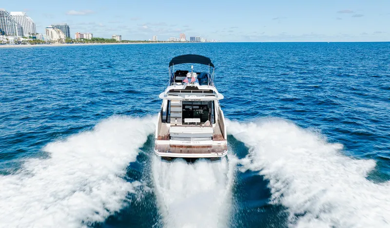 Slide: The Image of 2022 Galeon 400 Fly yacht cruising on open sea near coastline. - 17