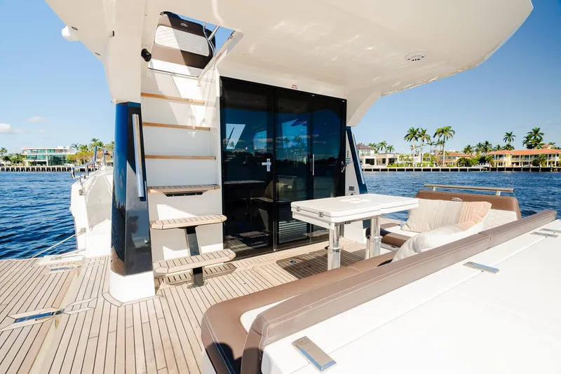 Slide: The Image of Galeon 400 Fly 2022 yacht deck with seating area and ocean view. - 19