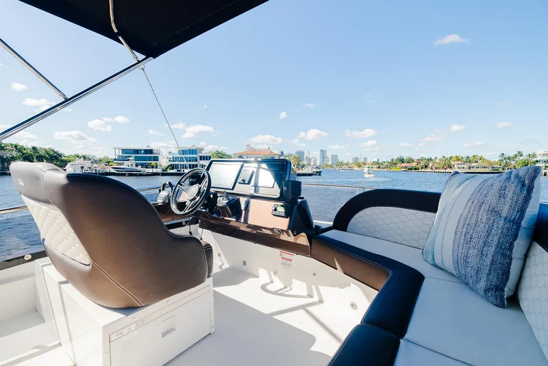 Slide: The Image of Luxurious 2022 Galeon 400 Fly yacht interior with city skyline view. - 23
