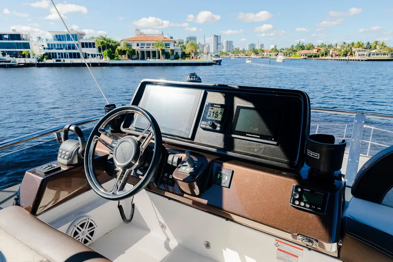 Slide: The Image of Helm of 2022 Galeon 400 Fly yacht with waterfront view. - 25