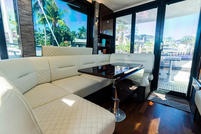 Slide: The Image of Luxurious interior of 2022 Galeon 400 Fly yacht with elegant seating and table. - 29