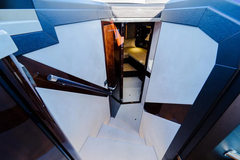 Slide: The Image of Interior staircase of 2022 Galeon 400 Fly yacht, featuring sleek design and modern finishes. - 36