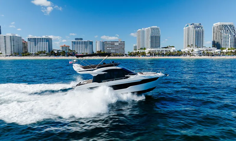 Slide: The Image of Galeon 400 Fly 2022 yacht cruising near city skyline on sunny day. - 7