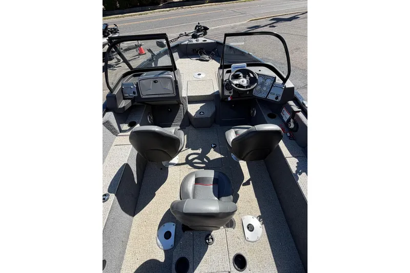 Slide: The Image of 2022 Tracker Pro Guide V-175 WT boat interior with dual consoles and seating. - 10